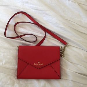 Kate Spade red leather crossbody purse.